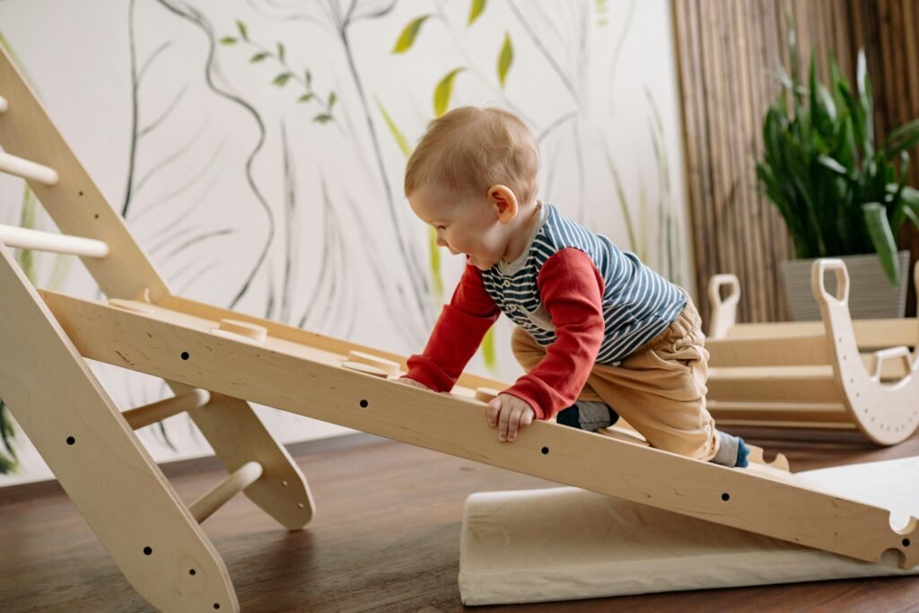 A young child enjoys climbing a wooden toy ladder indoors, promoting playtime and activity.